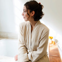 Thumbnail for Unisex Turkish Cotton Robe, Woman wearing Bone. Lightweight and Absorbent Turkish Cotton Towels. Luxuriously Soft and Eco-Friendly.