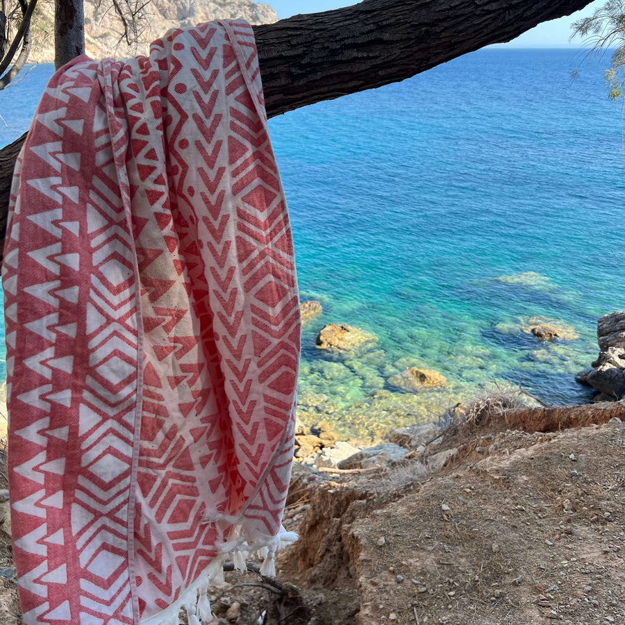 Bodrum Peshtemal in Coral, Lightweight and Quick-Drying Turkish Peshtemal Beach Towels. Versatile and Eco-Friendly.
