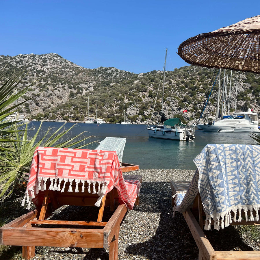 Catania Peshtemal in Coral, Lightweight and Quick-Drying Turkish Peshtemal Beach Towels. Versatile and Eco-Friendly.