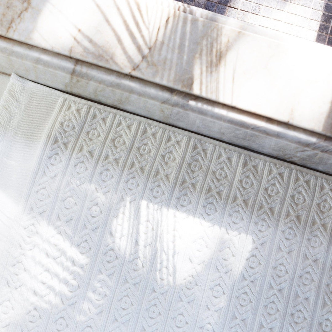 Fringed Ikat Bath Mat, Lightweight and Absorbent Turkish Cotton Towels. Luxuriously Soft and Eco-Friendly.