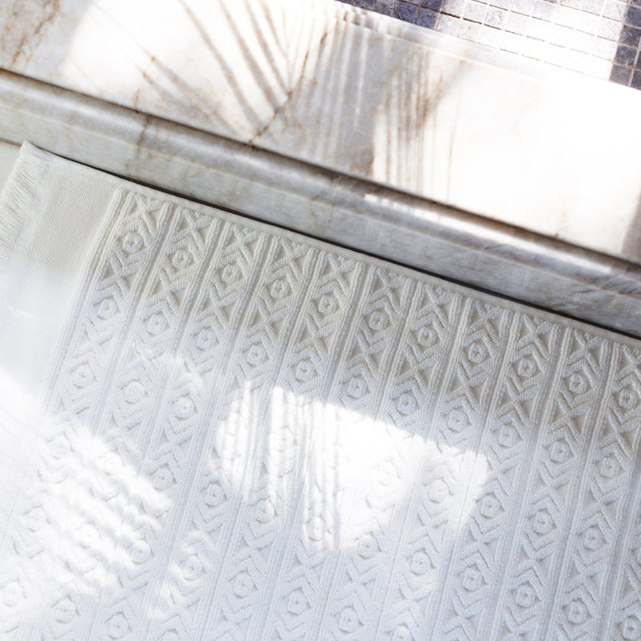 Fringed Ikat Bath Mat, Lightweight and Absorbent Turkish Cotton Towels. Luxuriously Soft and Eco-Friendly.