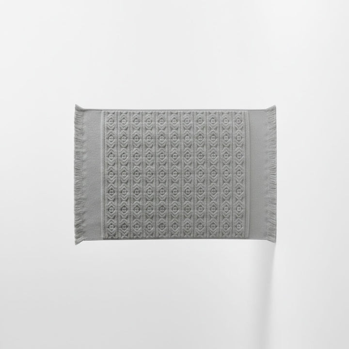 Gray bath mat on a white background